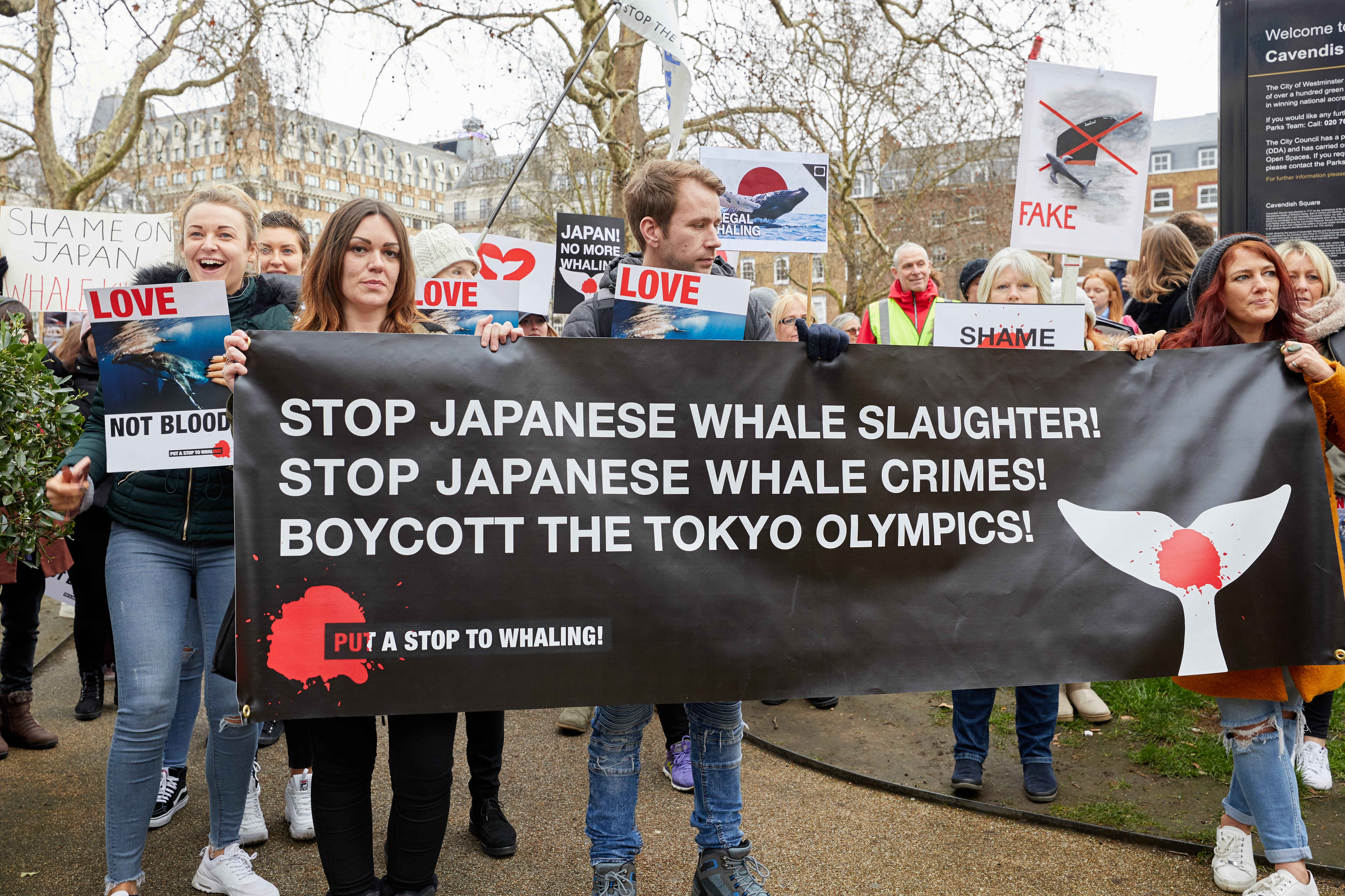 Protestors march in London against Japan resuming commercial whaling.